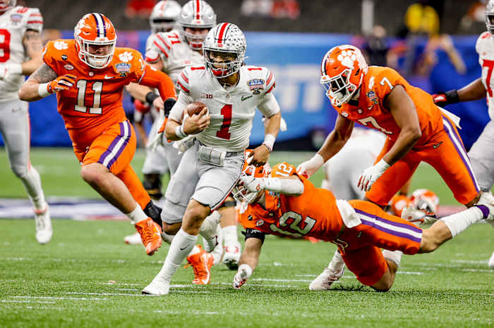 Ohio State QB Justin Fields runs during the playoff semifinal